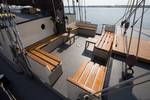 Deck seating area with wooden benches on the Eenhoorn