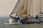 Bow of the Eenhoorn cutting through the waves under sail