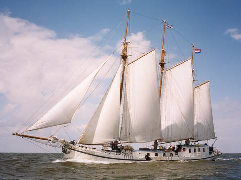 Three-masted clipper Elizabeth under white sails at sea
