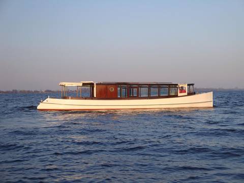 Saloon boat Emma with a wooden cabin