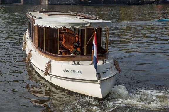 Saloon boat Emma cruising, viewed from the bow