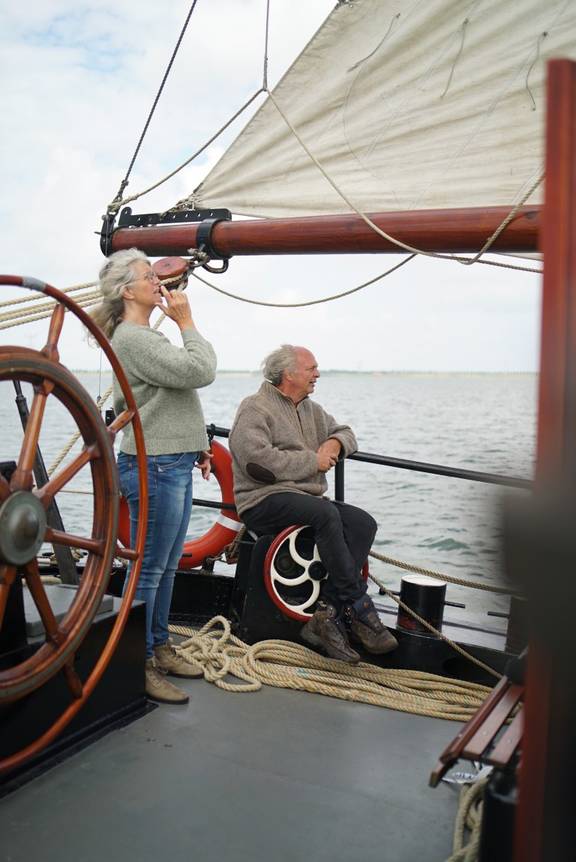 Sailor at the helm of the Engelburg under sail