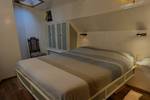 Double bed in a bright cabin of the Engelburg