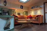 Seating area with a sofa and wooden table in the saloon of the Engelburg