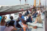 Guests sitting together on the deck of the Frisius van Adel