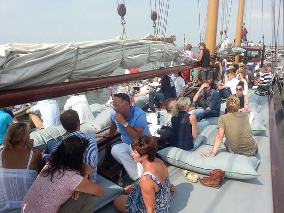 Guests sitting together on the deck of the Frisius van Adel
