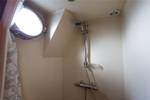 Shower with a porthole aboard the Grietje