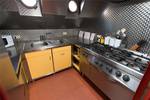Galley of the Grietje with a large gas cooker and double sink