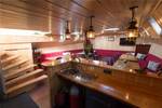 Bar and stairs to the deck in the saloon of the Grietje