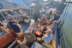 Group in the deck seating area of the Johanna Engelina