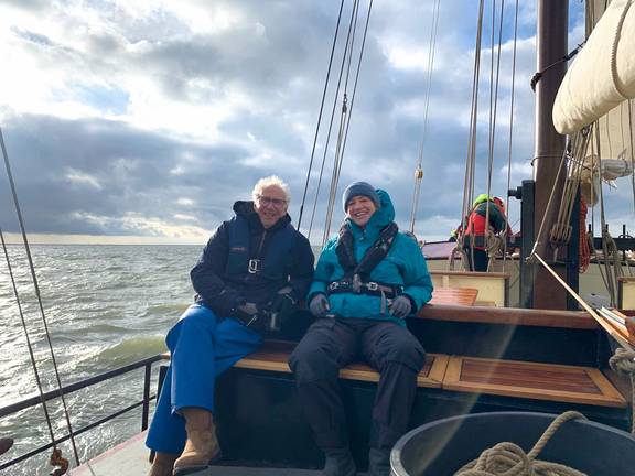 Guests sitting on the deck of the Johanna Engelina while sailing