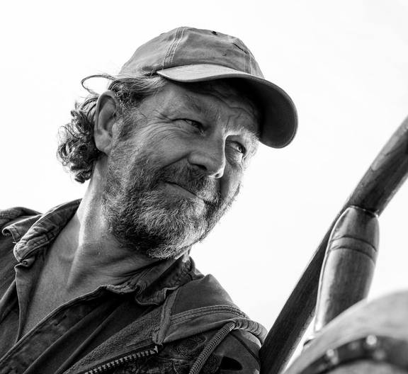 Black-and-white portrait of skipper Hans Luining