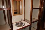 Washbasin and storage shelves in a cabin of the Korevaer