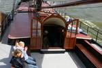 Seating area and saloon entrance on the deck of the Korevaer