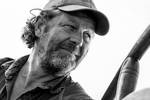 Black-and-white portrait of skipper Hans Luining