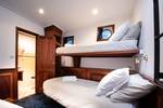 Cabin with a bunk bed and private bathroom on the Leafde fan Fryslân