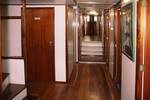 Wood-panelled corridor along the cabins of the Mars
