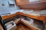 Cabin with wooden bunk beds on the Medusa