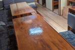 Long wooden dining table in the saloon of the Meridiaan