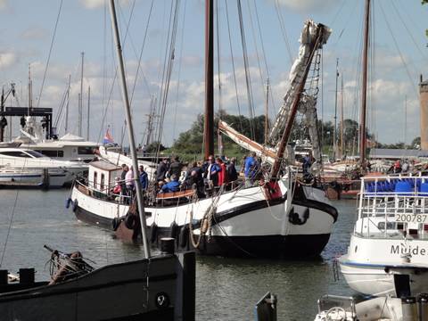 Nieuwe Zorg moored among other ships in the harbour