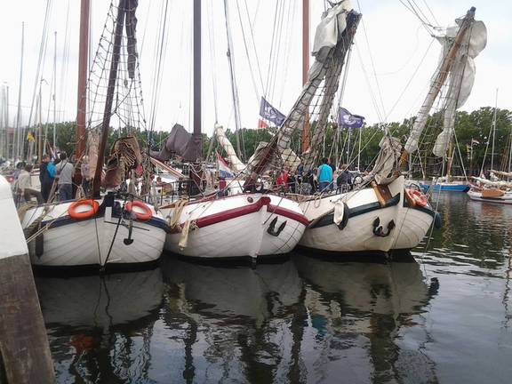 Tjalk Pelikaan moored among other ships in the harbour