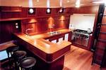 Wooden bar and galley with a cooker on the Poseidon
