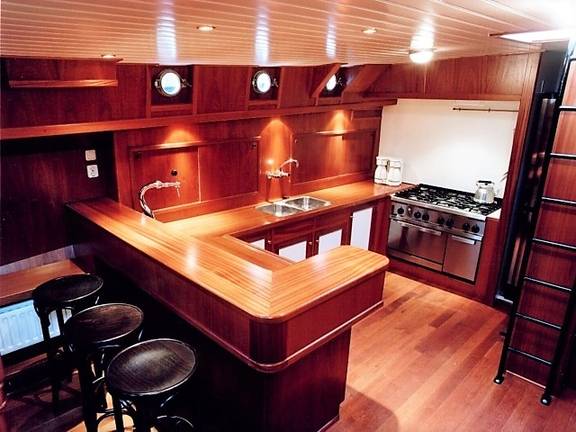 Wooden bar and galley with a cooker on the Poseidon