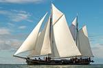 Two-masted clipper Pouwel Jonas with white sails hoisted