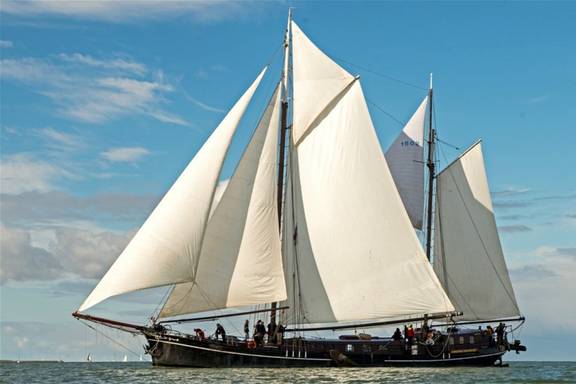Two-masted clipper Pouwel Jonas with white sails hoisted