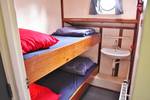 Cabin with a bunk bed and washbasin on the Rival