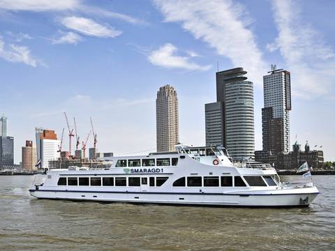 Party boat Smaragd 1 cruising past the Rotterdam skyline