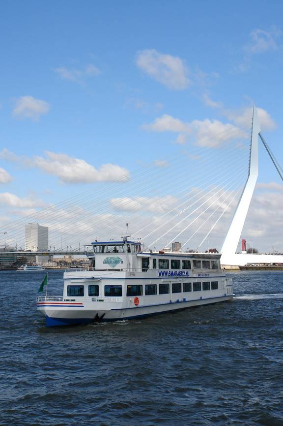 Party boat Smaragd 2 cruising past the Erasmus Bridge in Rotterdam