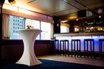 Bar with blue lighting and stools in the saloon of the Smaragd 2
