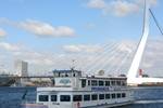 Party boat Smaragd 2 cruising past the Erasmus Bridge in Rotterdam