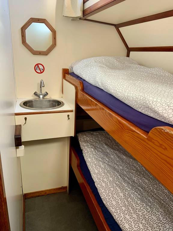 Cabin with a bunk bed and washbasin on the Spartivento