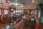 Saloon of the steamship Succes with tables and chairs