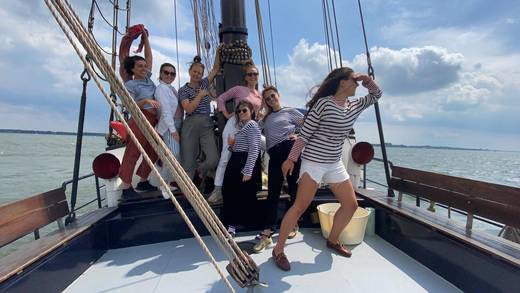 Studio Modijefsky colleagues together on deck during their company outing