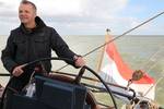 Man at the helm of the Sybaris