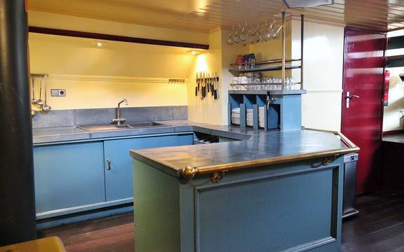 Light blue galley with a kitchen island on the Sybaris