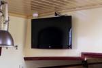 Wall-mounted television in the saloon of the Sybaris