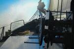 Water splashing over the foredeck of the Sybaris while sailing