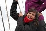 Young guest helping to hoist a sail on the Sybaris