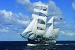 Tall ship Thalassa under full sail at sea