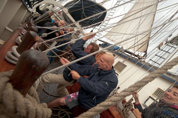 Sailors working together on the deck of the Thalassa