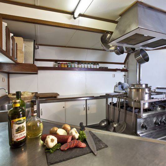 Galley of the Thalassa with stainless steel worktops