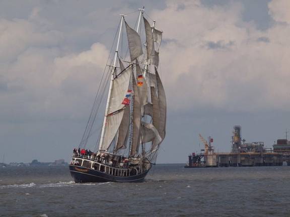 Thalassa under sail, viewed from behind