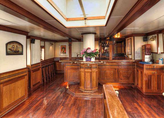 Wooden bar in the saloon of the Thalassa