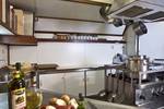 Galley of the Thalassa with stainless steel worktops