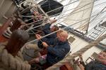 Sailors working together on the deck of the Thalassa