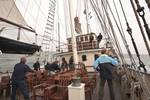 Sailors handling ropes on the deck of the Thalassa